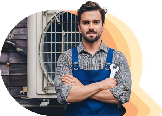 man wearing a blue overall with hvac in the background